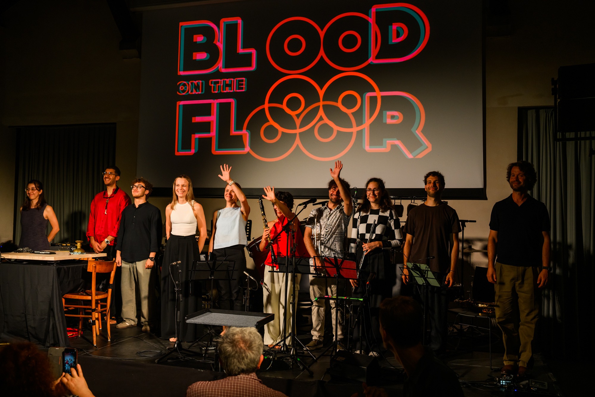 Index Ensemble taking a bow beneath the Blood on the Floor projection.