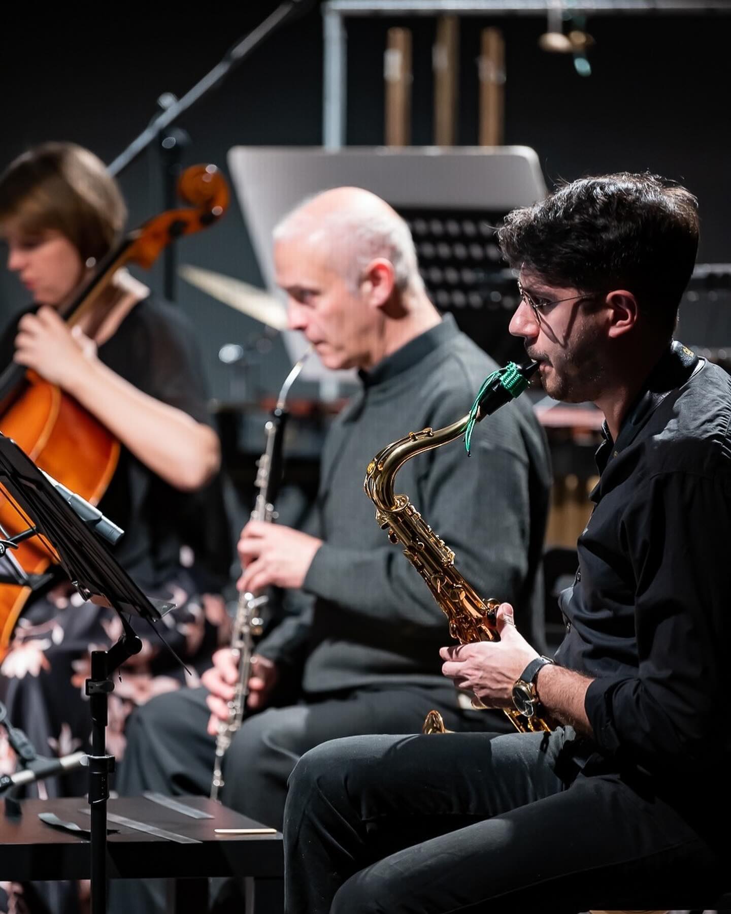 Alberto Cavallaro playing saxophone alongside other ensemble musicians.